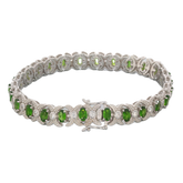 Oval green chrome diopside sterling silver bracelet with sparkling accents, showcasing elegance and luxury.