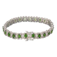 Oval green chrome diopside sterling silver bracelet with sparkling accents, showcasing elegance and luxury.