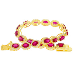 Gold bracelet featuring oval pink gemstones surrounded by sparkling accents, designed for elegance and luxury.