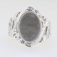 Custom sterling silver semi mount ring setting with intricate Art Nouveau design and oval spot for gemstone.
