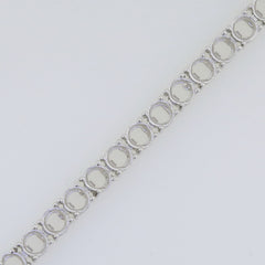 Custom sterling silver tennis bracelet setting with round gemstone placeholders ready for garnet stones.
