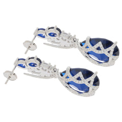 Elegant pear-shaped blue sapphire sterling silver earrings with sparkling accent stones.