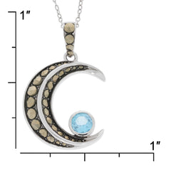 Round blue topaz sterling silver pendant with accent, featuring a celestial moon design and shimmering stones.