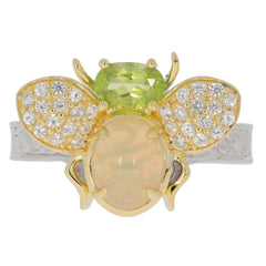 Elegant bee ring featuring a green peridot gemstone and opal inlay, adorned with sparkling diamonds.