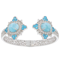 Oval blue Larimar Pectolite sterling silver bracelet with topaz accents, showcasing intricate design and luxury.