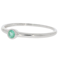 Round green emerald sterling silver ring with accent, showcasing a sparkling gemstone in a simple elegant design.