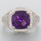Emerald purple amethyst sterling silver ring with accent gemstones, showcasing a sparkling purple stone in an elegant design.
