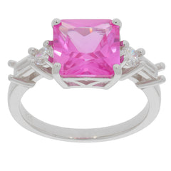 Emerald cut pink sapphire ring with sparkling accent stones set in sterling silver for elegance and style.