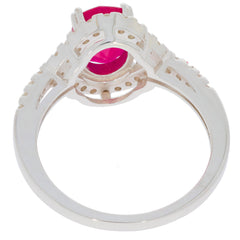 Oval red ruby sterling silver ring showcasing intricate design and sparkling gemstone, perfect for elegant styling.