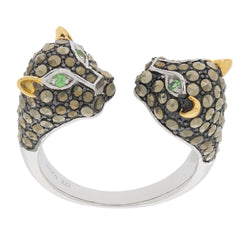 Unique sterling silver ring featuring two panther heads with green accents and sparkling gemstones for a bold look.