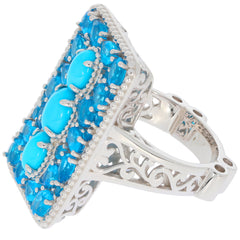 Oval blue turquoise sterling silver ring with intricate design and sparkling accents.