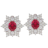 Oval pink sapphire sterling silver earrings with sparkling accents, showcasing luxury and elegance.