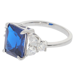 Emerald blue sapphire sterling silver ring with accent stones, showcasing a radiant gemstone design.