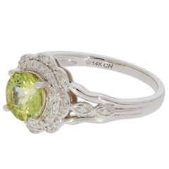 Green Peridot ring in 14K white gold with diamond accents, showcasing elegant design and radiant gemstone brilliance.