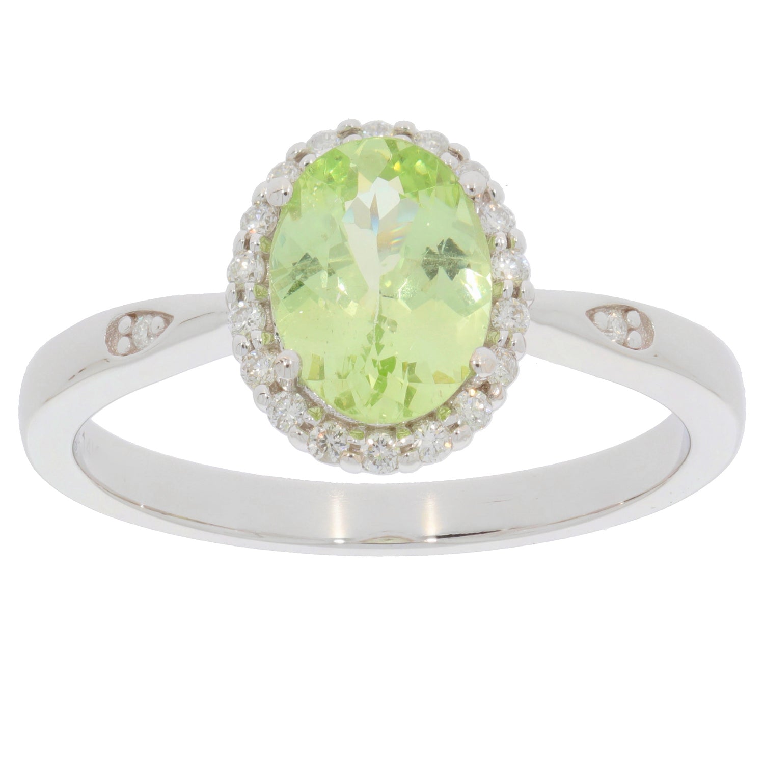 Green Peridot ring in 14K white gold with diamond accents, showcasing an oval gemstone centerpiece and elegant design.