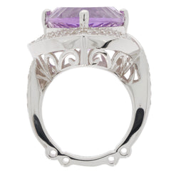Trillion purple amethyst sterling silver ring showcasing intricate design and brilliant gemstone from a side view.
