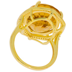 Oval yellow citrine sterling silver ring featuring a sparkling gemstone with intricate design details.