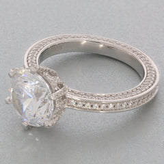 White Moissanite sterling silver ring with accent, featuring an elegant sparkling gemstone.