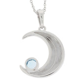 Round blue topaz sterling silver pendant in crescent moon design, featuring a sparkling blue gemstone accent.