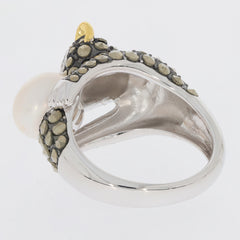 Back view of a unique silver ring featuring pearl and intricate stone detailing.