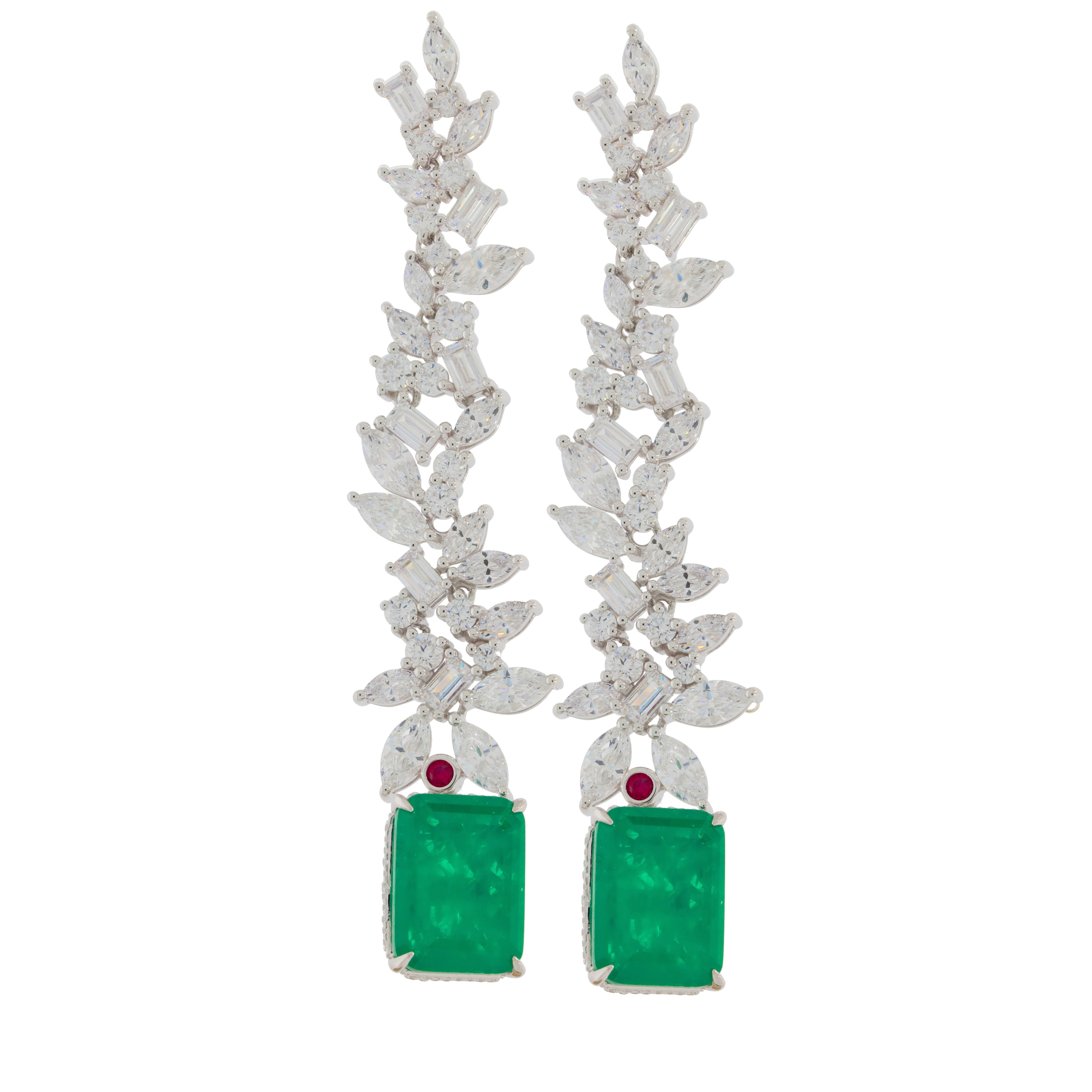 Green emerald sterling silver earrings with floral accents, showcasing elegance and luxury.