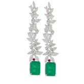 Green emerald sterling silver earrings with floral accents, showcasing elegance and luxury.