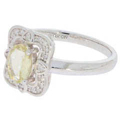 Elegant yellow sapphire ring in 14K white gold with diamond accents, perfect for sophisticated style.