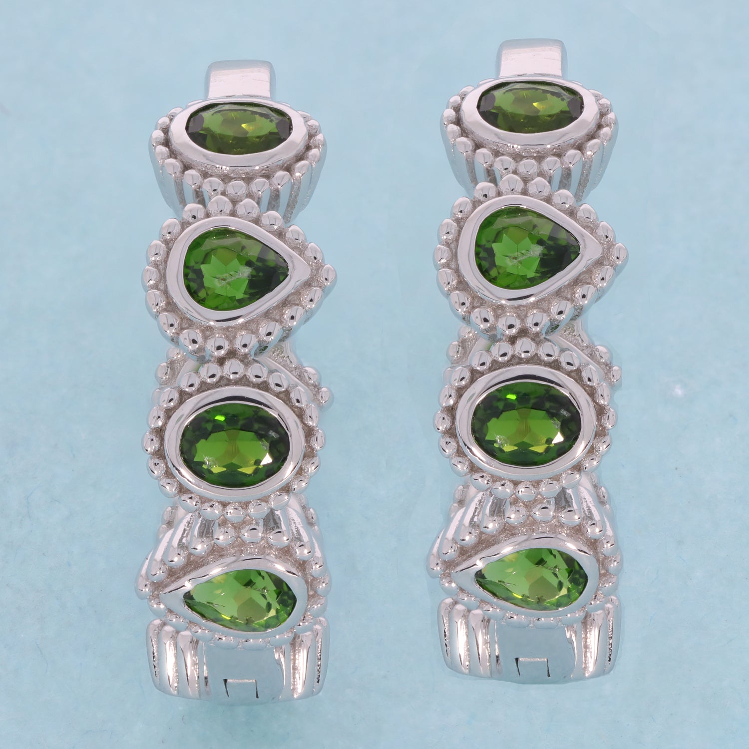 Elegant Oval Green Chrome Diopside Sterling Silver Earrings with sparkling gemstones accents.
