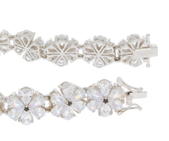 Elegant Pear White Moissanite Sterling Silver Bracelet featuring floral patterns and sparkling gemstones.