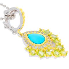 Blue turquoise sterling silver pendant with green accents, showcasing elegant design and luxurious craftsmanship.