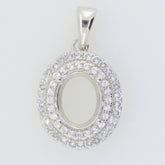 Sterling Silver Oval Pendant Setting with Halo, ready for your choice of gemstone, featuring White Topaz accents.