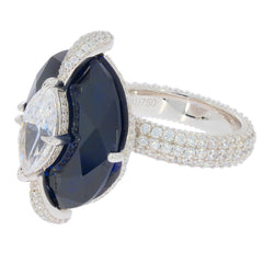 Oval blue sapphire and diamond accent sterling silver ring, showcasing luxury and elegance.