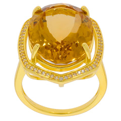 Oval yellow citrine sterling silver ring with accent gems, showcasing luxury and elegance.