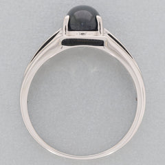 Oval black spinel sterling silver ring showcasing elegance and luxury, featuring a polished gemstone design.