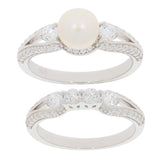White pearl sterling silver ring with accent gemstones, showcasing elegant design and luxury craftsmanship.