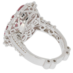 Elegant pink sapphire sterling silver ring showcasing intricate design and gemstone brilliance from the side view.