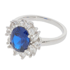 Oval blue sapphire sterling silver ring with sparkling accent stones, perfect for elegant styling.