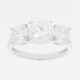 Round white Moissanite sterling silver ring with three sparkling stones for a luxurious look.