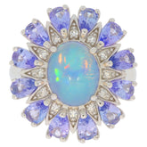 Elegant blue opal sterling silver ring with sparkling gemstone accents, perfect for sophisticated jewelry collections.