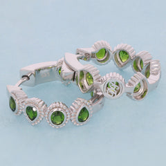 Oval green chrome diopside sterling silver earrings with sparkling gemstones, showcasing elegance and luxury.
