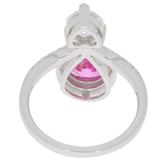 Pink Sapphire sterling silver ring with moissanite accent, showcasing elegant gemstone design and luxurious finish.