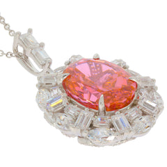 Oval orange sapphire sterling silver pendant with sparkling accents, radiating elegance and luxury.