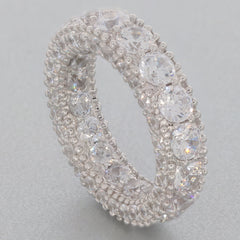 White Moissanite sterling silver ring showcasing sparkling gemstones in an elegant design, perfect for sophisticated style.