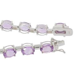Oval Purple Amethyst Sterling Silver Bracelet showcasing sparkling gemstones and elegant design.