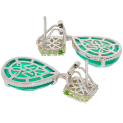 Elegant green jadeite earrings in sterling silver with intricate design and sparkling gemstone accents.
