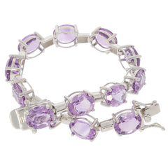Elegant oval purple amethyst sterling silver bracelet showcasing sparkling gemstones and a sophisticated design.