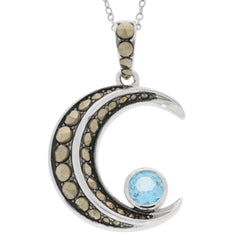 Round blue topaz pendant set in sterling silver with decorative accents, perfect for elegant jewelry collections.