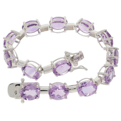 Oval purple amethyst sterling silver bracelet showcasing elegant gemstones in a luxurious design.