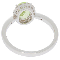Elegant Green Peridot ring in 14K white gold setting with diamond accent, showcasing sparkling gemstone design.