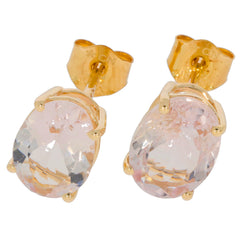 Round pink sapphire earrings in 14K yellow gold setting, featuring brilliant shimmering gemstones for elegant style.